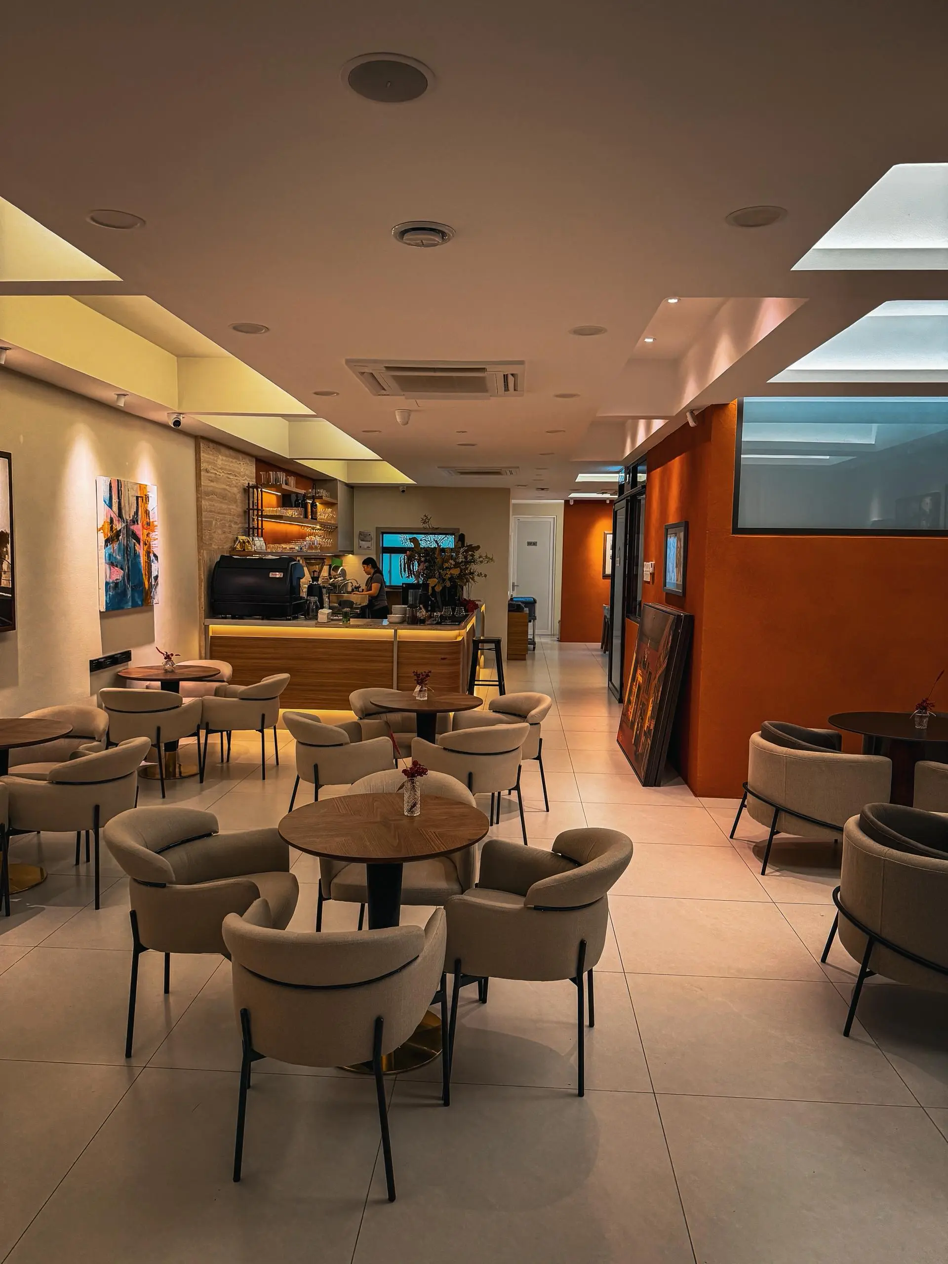 Wide interior view with signature orange accent wall